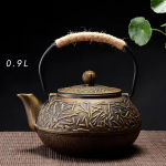 Gietijzeren theepot met reliëfmotieven — Gouden takken