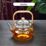 Glazen theepot met filter en houten handvat