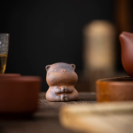 Keramieken tea pet voor de theetafel