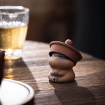 Keramieken tea pet voor de theetafel