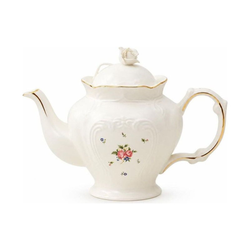 Porseleinen theepot met bloemen en retrodecor