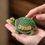 Schildpad tea pet van hars met geluksmotief