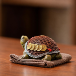 Schildpad tea pet van hars met geluksmotief