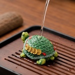 Schildpad tea pet van hars met geluksmotief