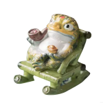 Tea pet kikker in een schommelstoel