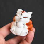 Tea pet met negenstaartige vos