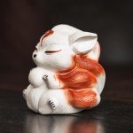 Tea pet met negenstaartige vos