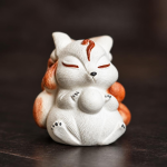 Tea pet met negenstaartige vos
