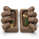 Tea pet met vier varkens van paarse klei