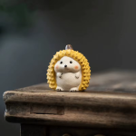 Thee pet egel met doerianschil van paarse klei