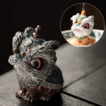 Thermochromische tea pet met dansende leeuw van hars — Blauwgroen en zilverkleurig