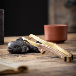 Vis als gongfu tea pet van paarse klei