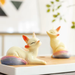 Vossen tea pet van hars met warmtegevoelige staart