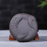 Yixing tea pet met gestileerd gezicht